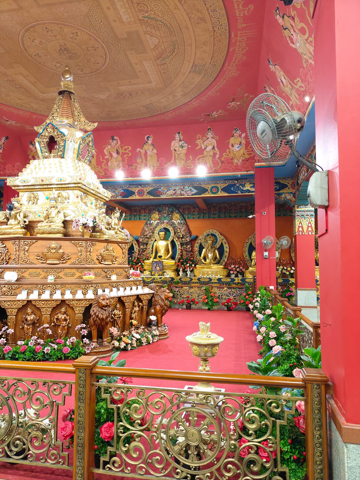 Golden Buddha statues inside the Namdroling Golden Temple at Bylakuppe, Coorg