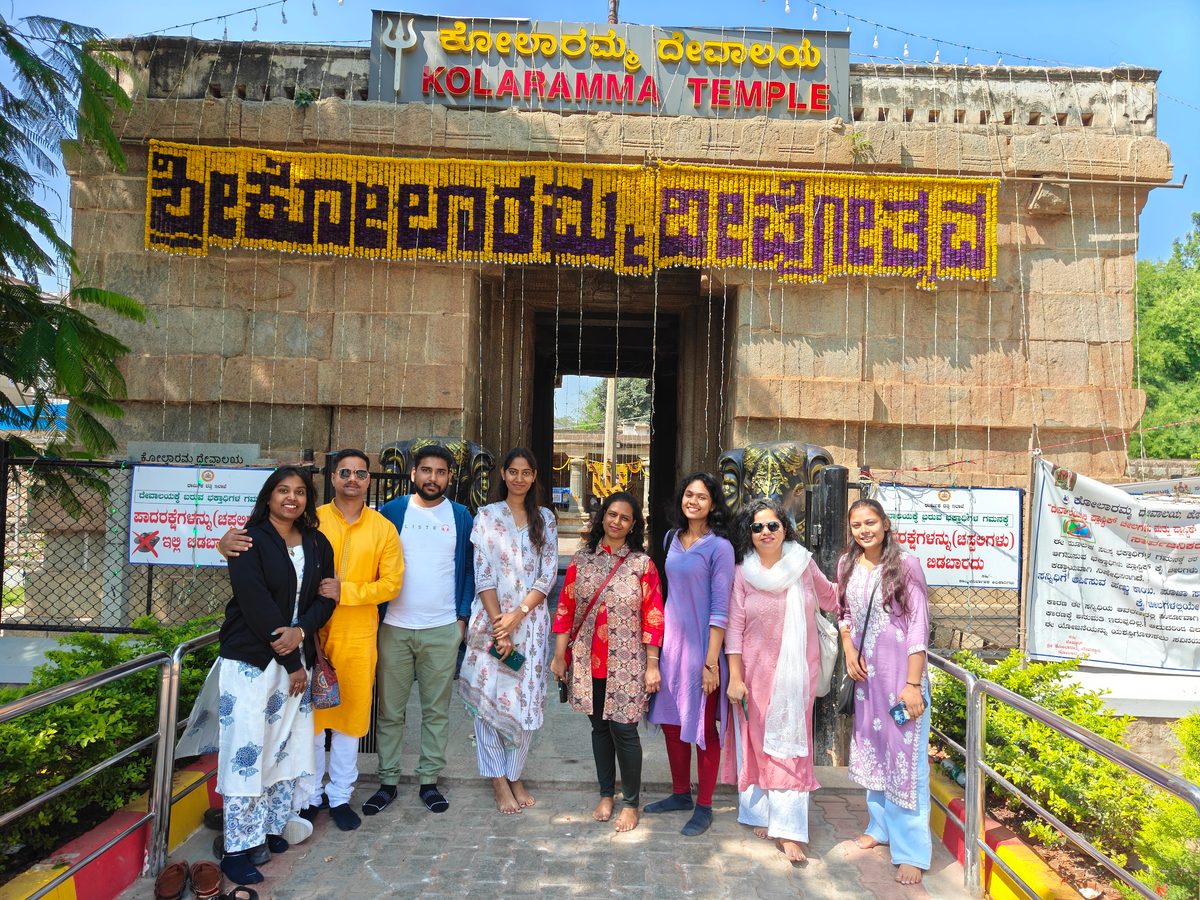 The stone gateway of Kolaramma Temple in Kolar, decorated with marigold garlands